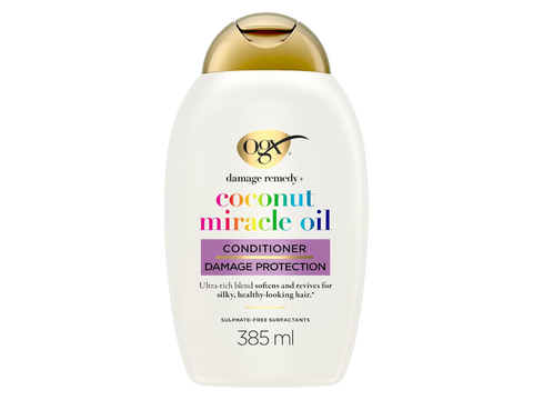 OGX coconut miracle oil conditioner bottle on a white background