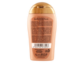 Back of a shampoo bottle with gold cap on a white background