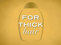 Shampoo bottle with 'For Thick Hair' text on a yellow background