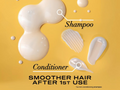 Shampoo and conditioner bottles with product application on a yellow background