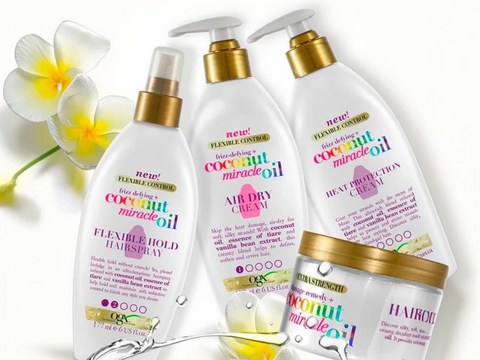 Set of hair care products with coconut oil branding on a white background