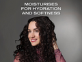 Woman with curly hair against a gray background with text about moisturizers for hydration and softness.