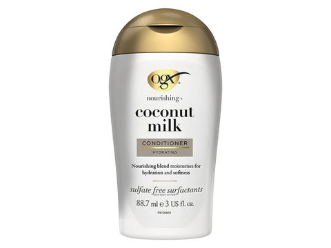 OGX Coconut Milk Conditioner bottle on a white background