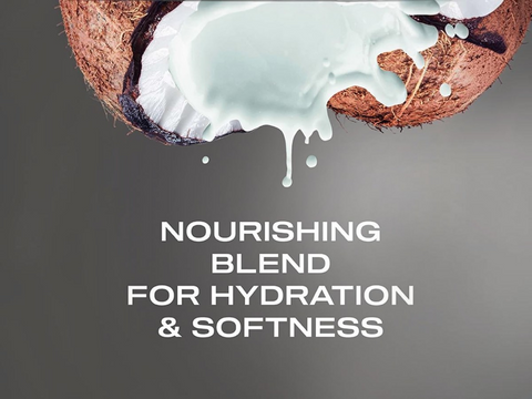 Coconut with white cream on a gray background with text 'Nourishing Blend for Hydration & Softness'.