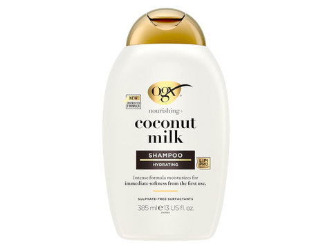 OGX Coconut Milk shampoo bottle on a white background
