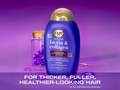 OGX shampoo bottle with a purple background