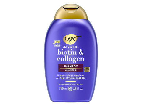Purple shampoo bottle with gold cap on a white background