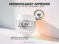 Olay Collagen Peptide day cream jar with branding and approval text on a light background