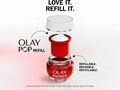 Olay Regenerist refillable cream jar with red lid on a white background