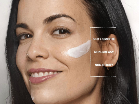 Woman's face with skincare product applied, showing texture and feel.