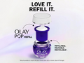 Olay Pop refillable skincare product with text 'Love it. Refill it.' on a light purple background.