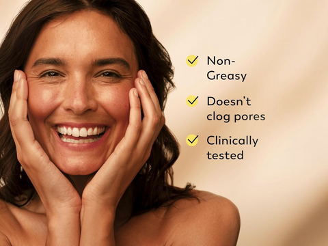 Woman with a happy expression touching her face, with text highlighting product benefits on a beige background.