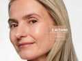 Close-up of a woman's face with text indicating '3 Actions' for skin care.