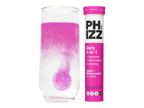 PHIZZ daily supplement with a glass of pink liquid on a white background