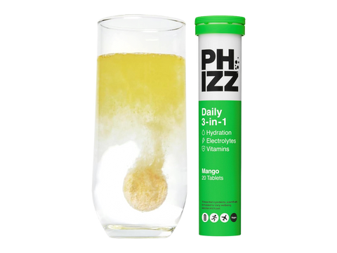 PHIZZ daily supplement tube with a glass of yellow liquid on a white background
