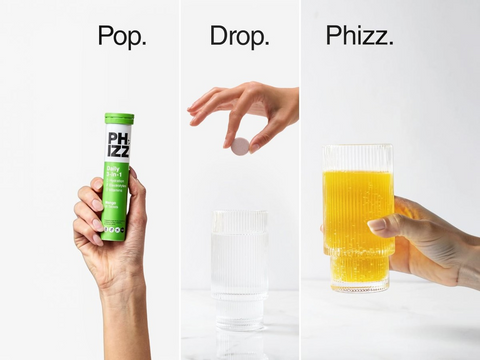 PHIZZ drink mix packaging with a hand holding a packet, a hand dropping it into a glass of orange juice, and the glass of juice being held.