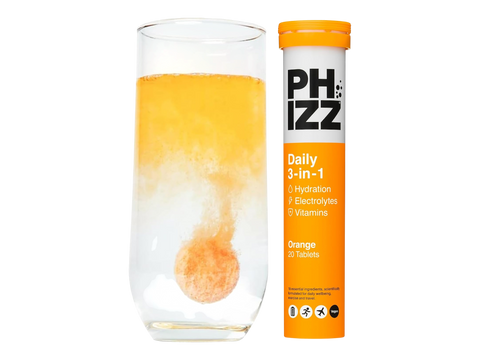 PHIZZ Daily 3-in-1 supplement with a glass of orange juice on a white background