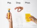 Step-by-step process of opening a PHIZZ drink container and pouring it into a glass.