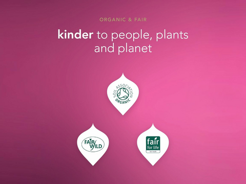 Three organic and fair trade logos on a pink background with text 'kinder to people, plants and planet'.