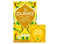 Pukka lemon, ginger, and manuka honey herbal tea packaging on a white background