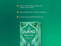 Pukka three mint herbal tea packaging on a green background with sustainability information.