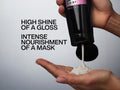 Redken Hair Mask being squeezed from a tube.