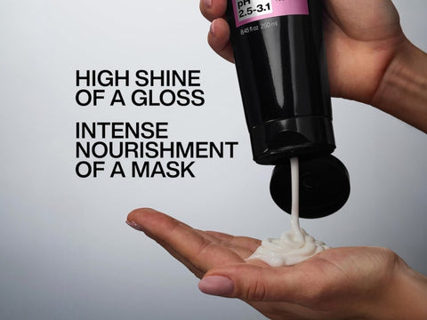 Redken Hair Mask being squeezed from a tube.