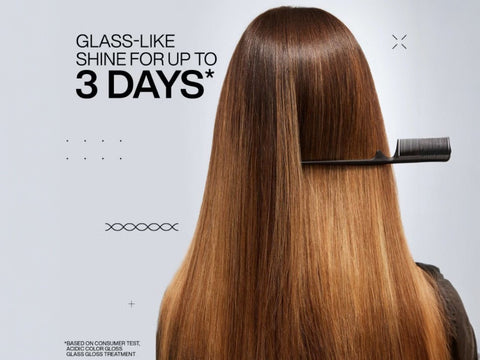 Redken Gloss Treatment being applied to mid-lengths of hair.