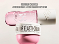 Pink jar of Sol de Janeiro Elastica Flor Elasti-Cream with visible brand logo on a light background.