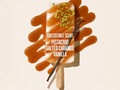 Pistachio salted caramel vanilla ice cream bar with caramel drizzle and vanilla bean on a beige background