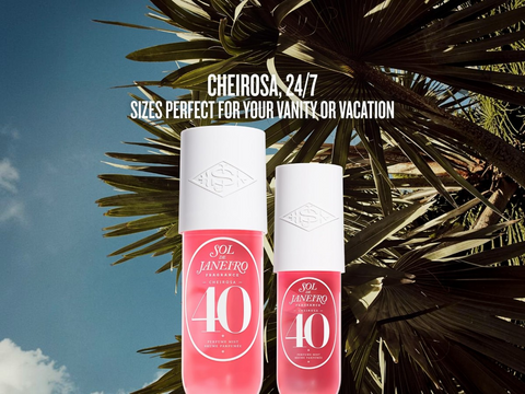 Two pink bottles with white caps on a background of palm leaves and blue sky.