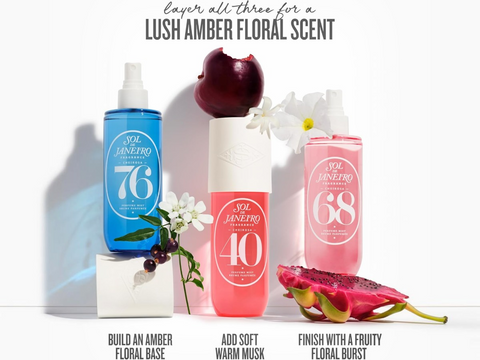 Three bottles of perfume with floral and fruit elements on a white background