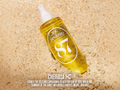 Suntory Sol de Janeiro Cheirosa 87 bottle on sand with brand text overlay