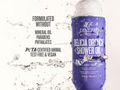 Purple shower oil bottle with water droplets and text about product features on a white background