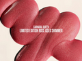 Close-up of a rose gold shimmer makeup product with 'Carnaval Queen' text.