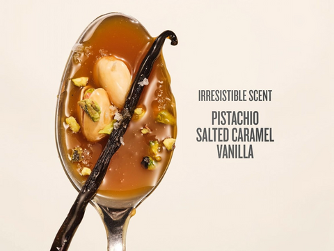 Spoon with salted caramel, vanilla beans, and pistachios on a beige background