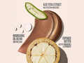 Cosmetic product with aloe vera, cupuaçu butter, and nourishing oil blend on a beige background.