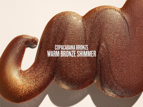 Close-up of a warm bronze shimmer product with 'Copacabana Bronze' text on a beige background
