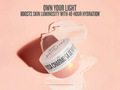 Cosmetic jar with text on a pink background