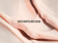 Close-up of water-whipped body cream with a soft focus background
