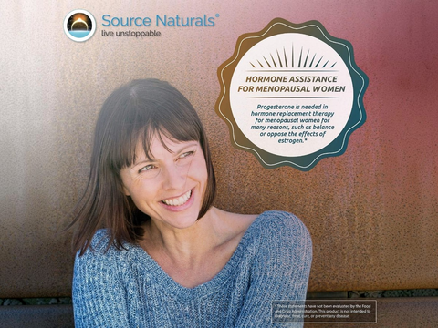 Woman smiling with Source Naturals advertisement about hormone assistance for menopausal women.