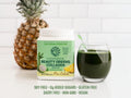 Sunwarrior Beauty Greens Collagen Superfood Drink next to a full glass