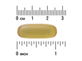 Yellow capsule pill with a ruler for scale on a white background