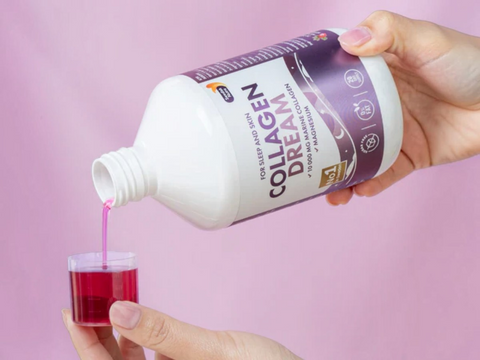 Collagen Dream bottle being poured into a small glass against a pink background
