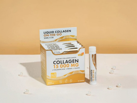 Box of Liquid Collagen On-The-Go with a single shot on a beige background