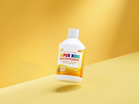 Super Kids Multivitamin bottle on a yellow background