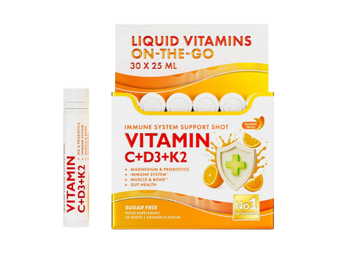 Box of liquid vitamins with a bottle on a white background