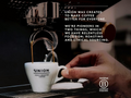 Hand holding a Union coffee cup with roasting equipment in the background and text about the brand's focus on roasting and ethical sourcing.