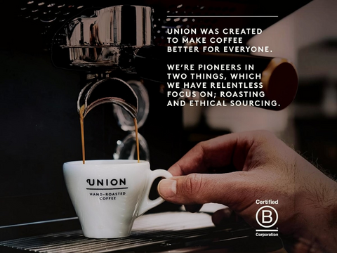 Hand holding a Union coffee cup with roasting equipment in the background and text about the brand's focus on roasting and ethical sourcing.