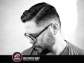 Uppercut Deluxe Pomade 100g styled slick back hairstyle example with high shine finish